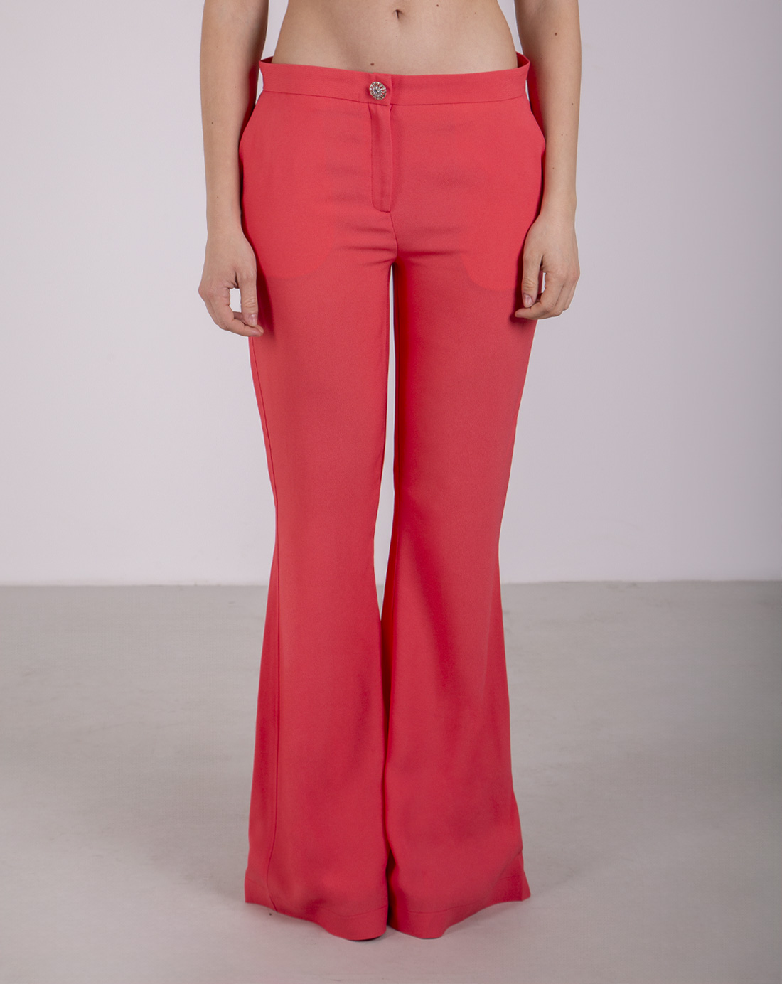 Coral-colored flare pants